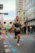 Man running a race on a city street.