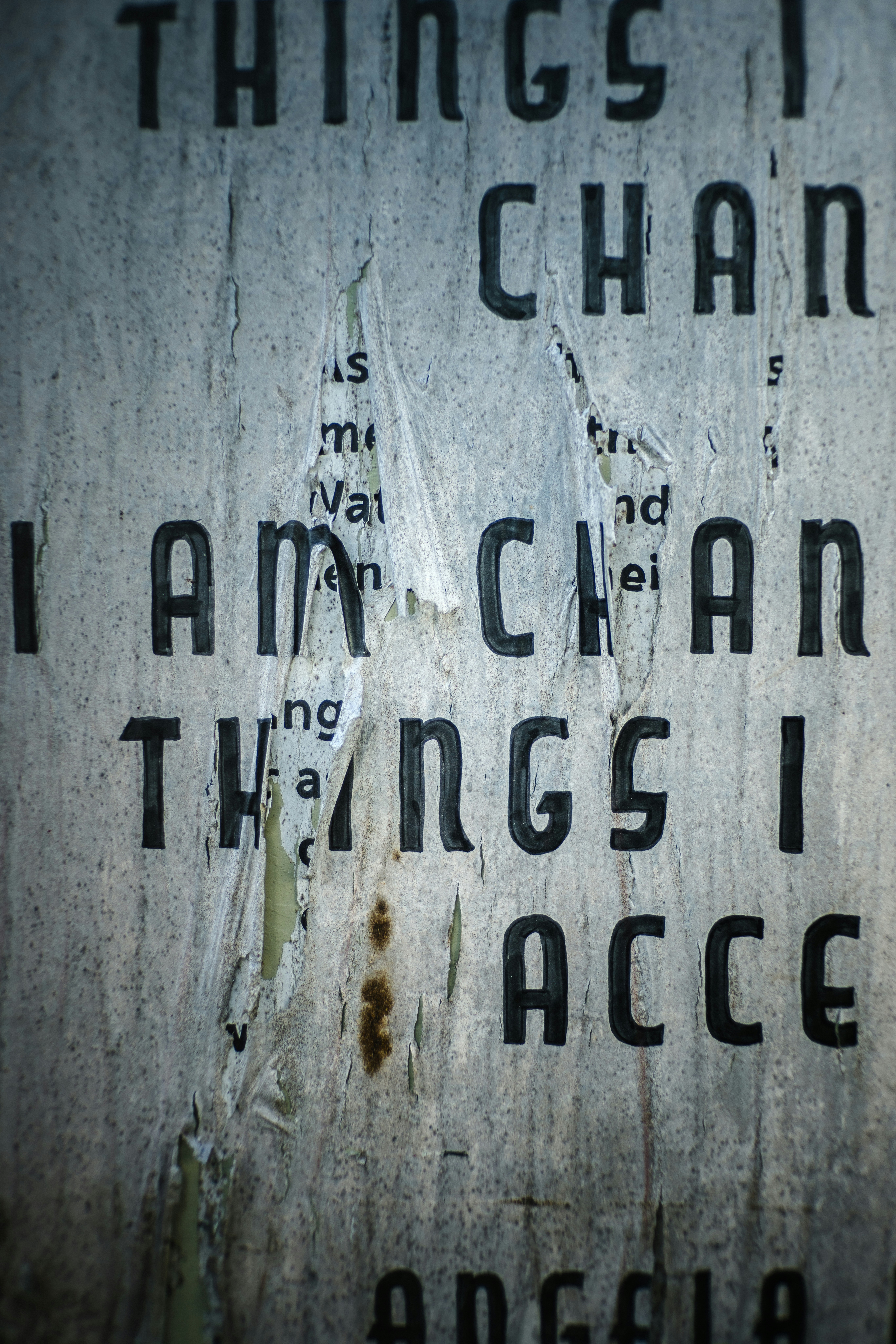 Torn poster with text "i am changing things i accept".