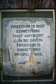 Weathered poster with quote about freedom.