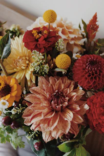 A vibrant bouquet of assorted autumn flowers.