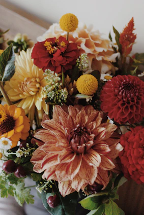 A vibrant bouquet of assorted autumn flowers.