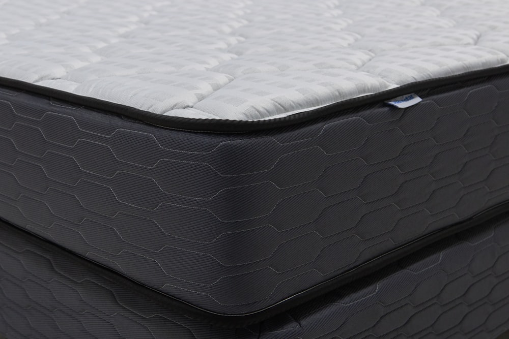 Close-up of modern mattress surface showing protective fabric layer