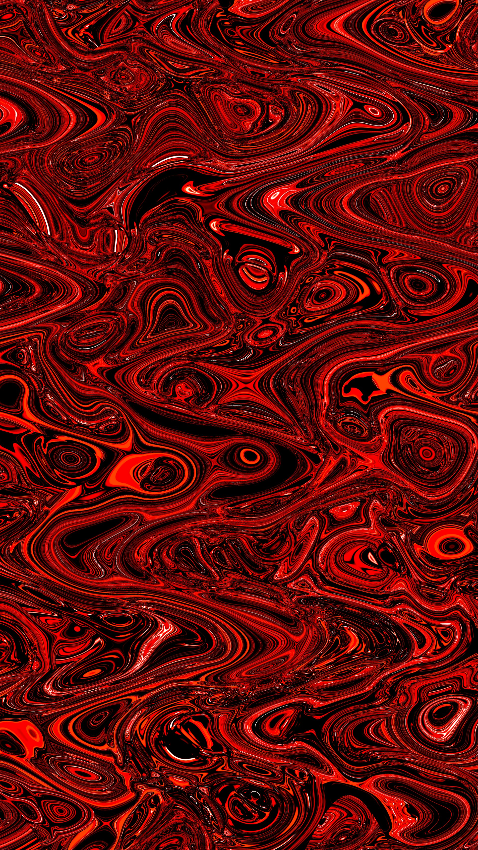 Abstract swirling pattern of red and black textures.