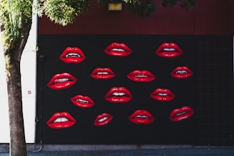 Red lips mural on a dark wall