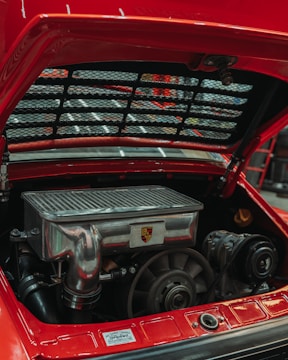 Close-up of a vintage red porsche engine bay.