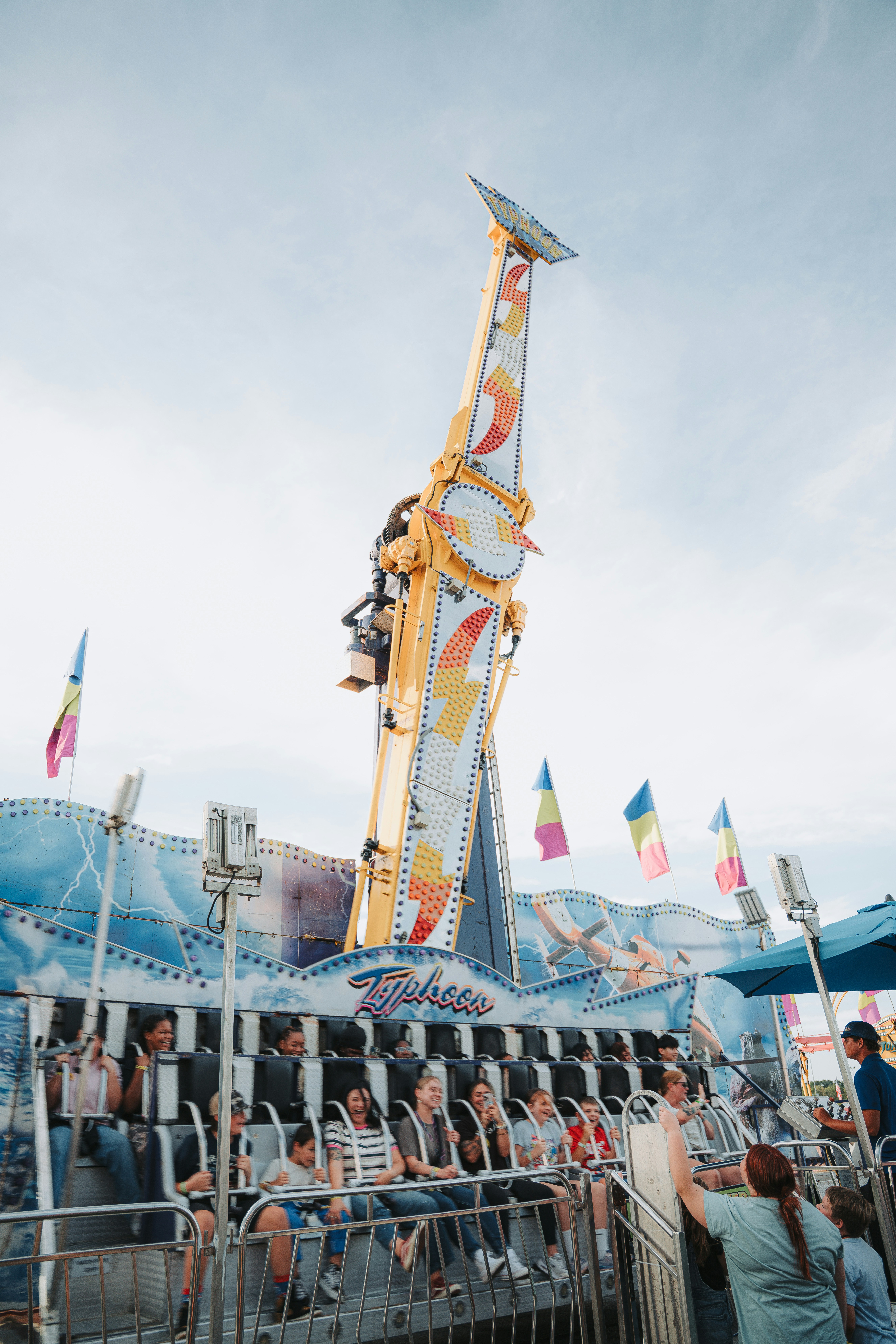 Amusement park ride with people enjoying the attraction photo – Free ...