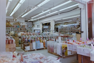 Interior of a well-stocked grocery store with aisles of goods.