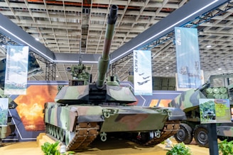 A modern military tank with camouflage pattern.