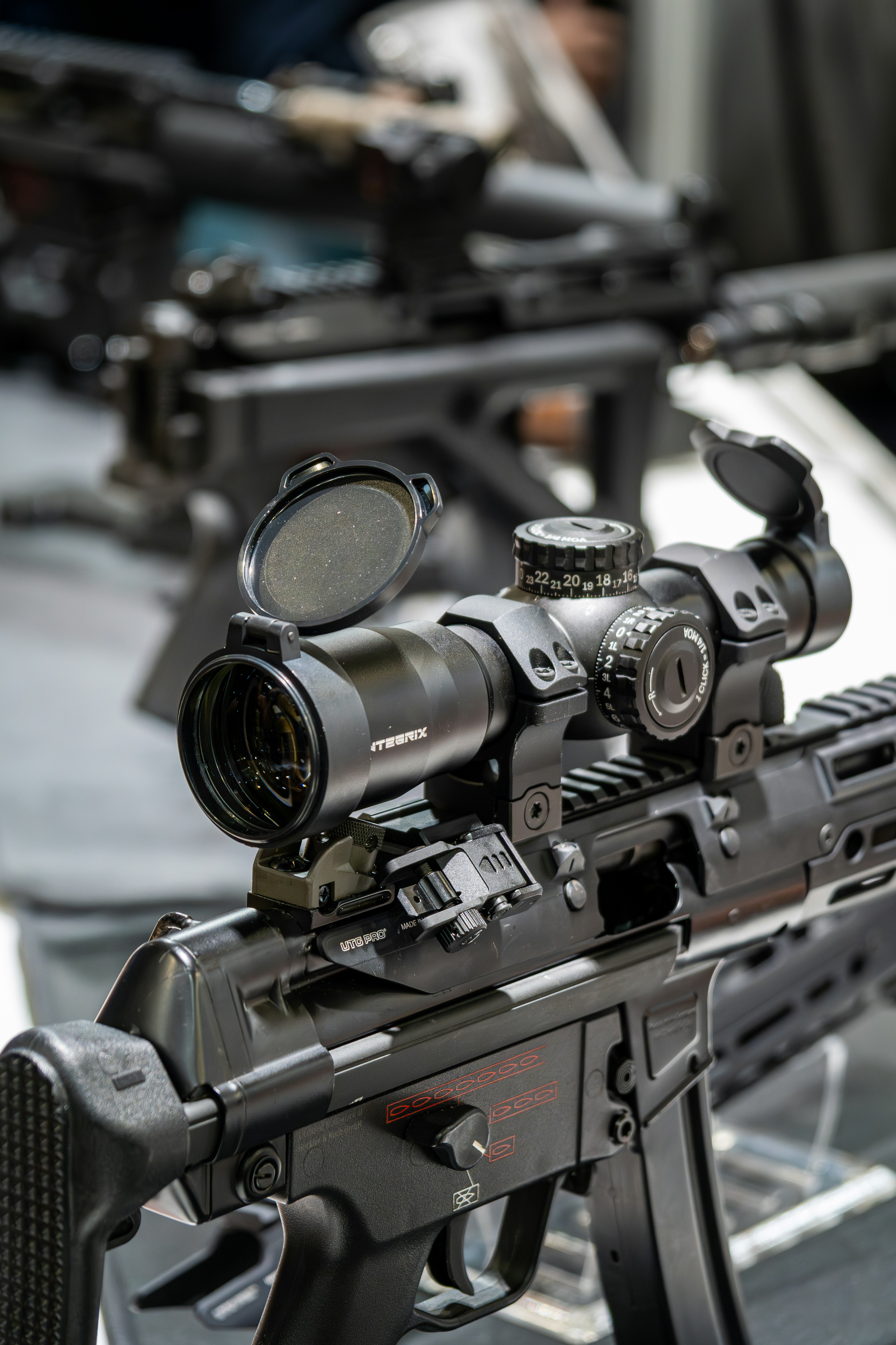 Close-up of a tactical rifle with scope