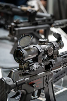 Close-up of a tactical rifle with scope