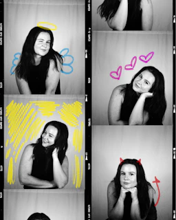 Woman with devil and angel drawings in photo booth strip