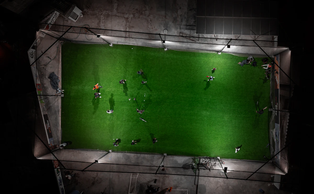 Aerial view of a floodlit small sided pitch