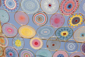 Colorful circular patterns against a blue sky