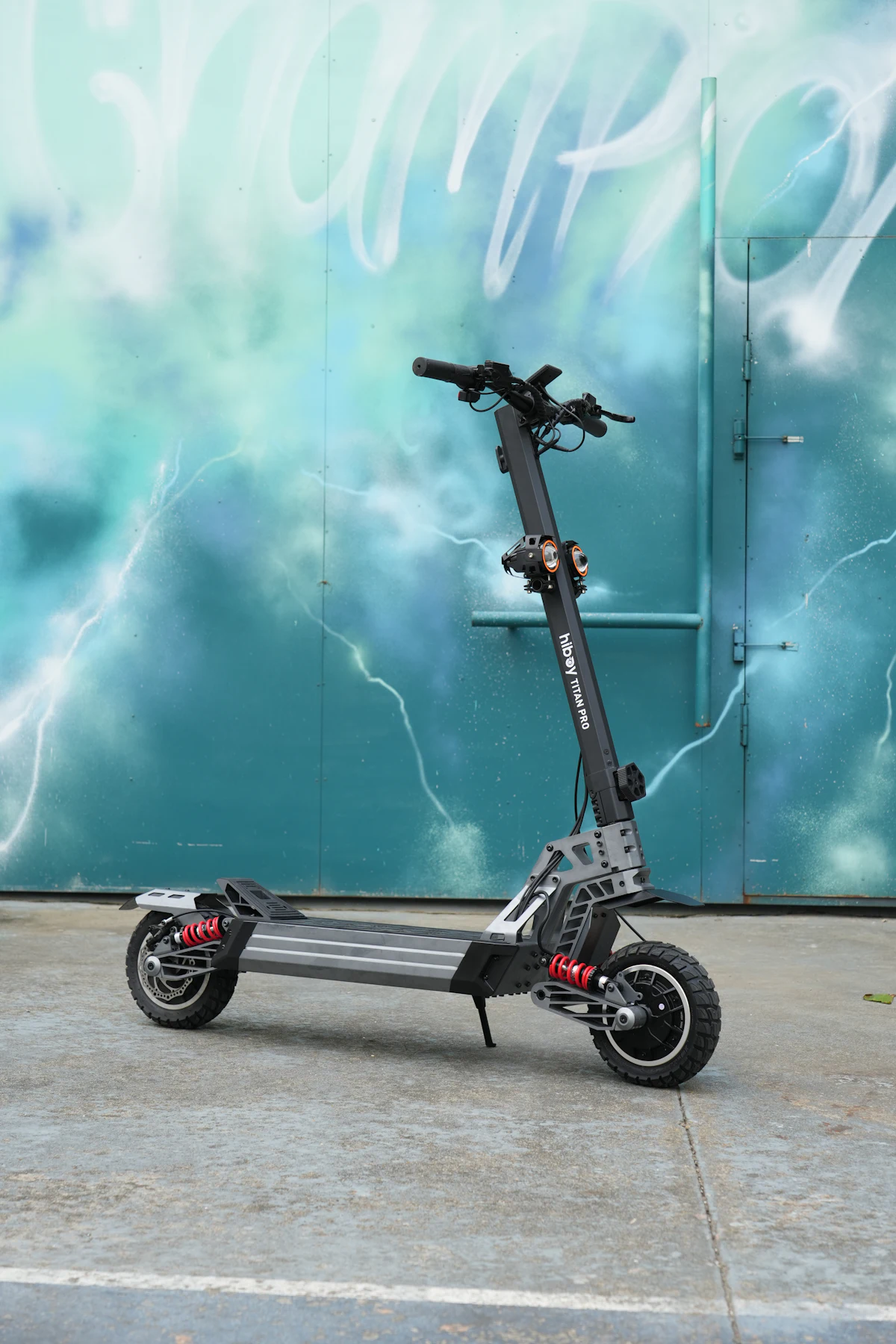 Electric scooter against a graffiti wall