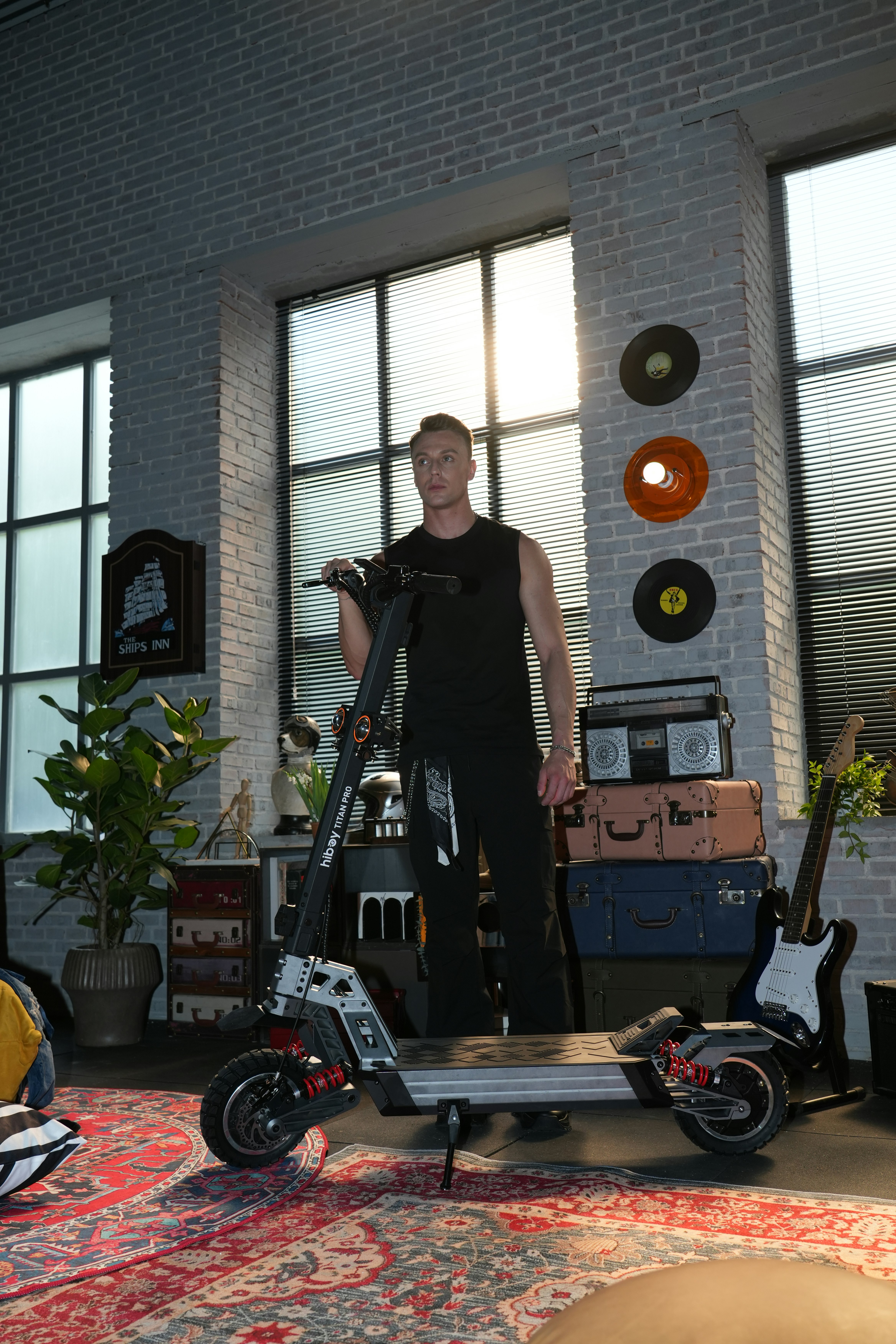 Man standing with electric scooter in retro room