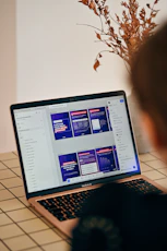 Person looking at a laptop screen with presentation slides.