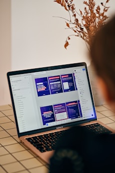 Person looking at a laptop screen with presentation slides.