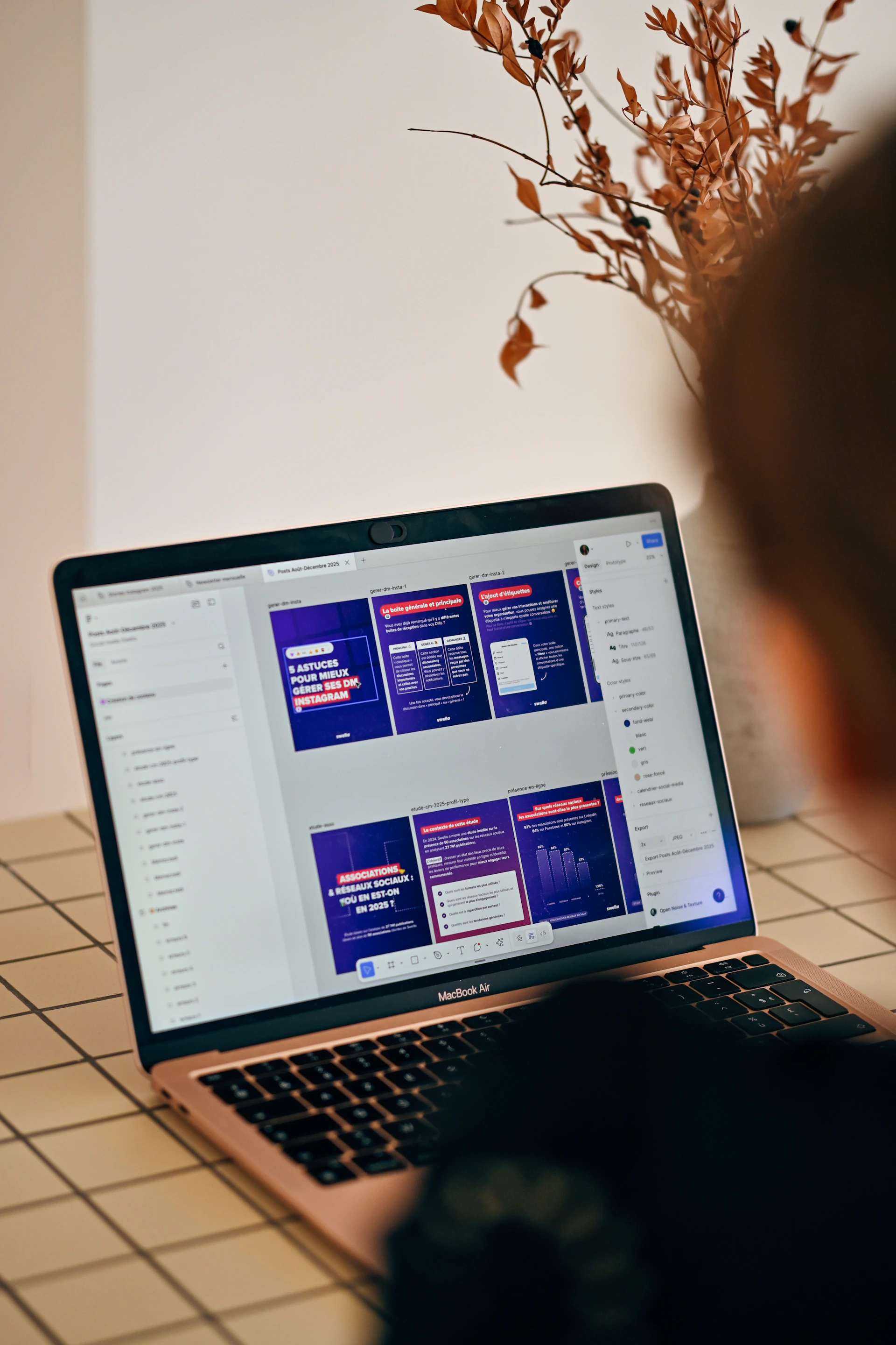 Person looking at a laptop screen with presentation slides.