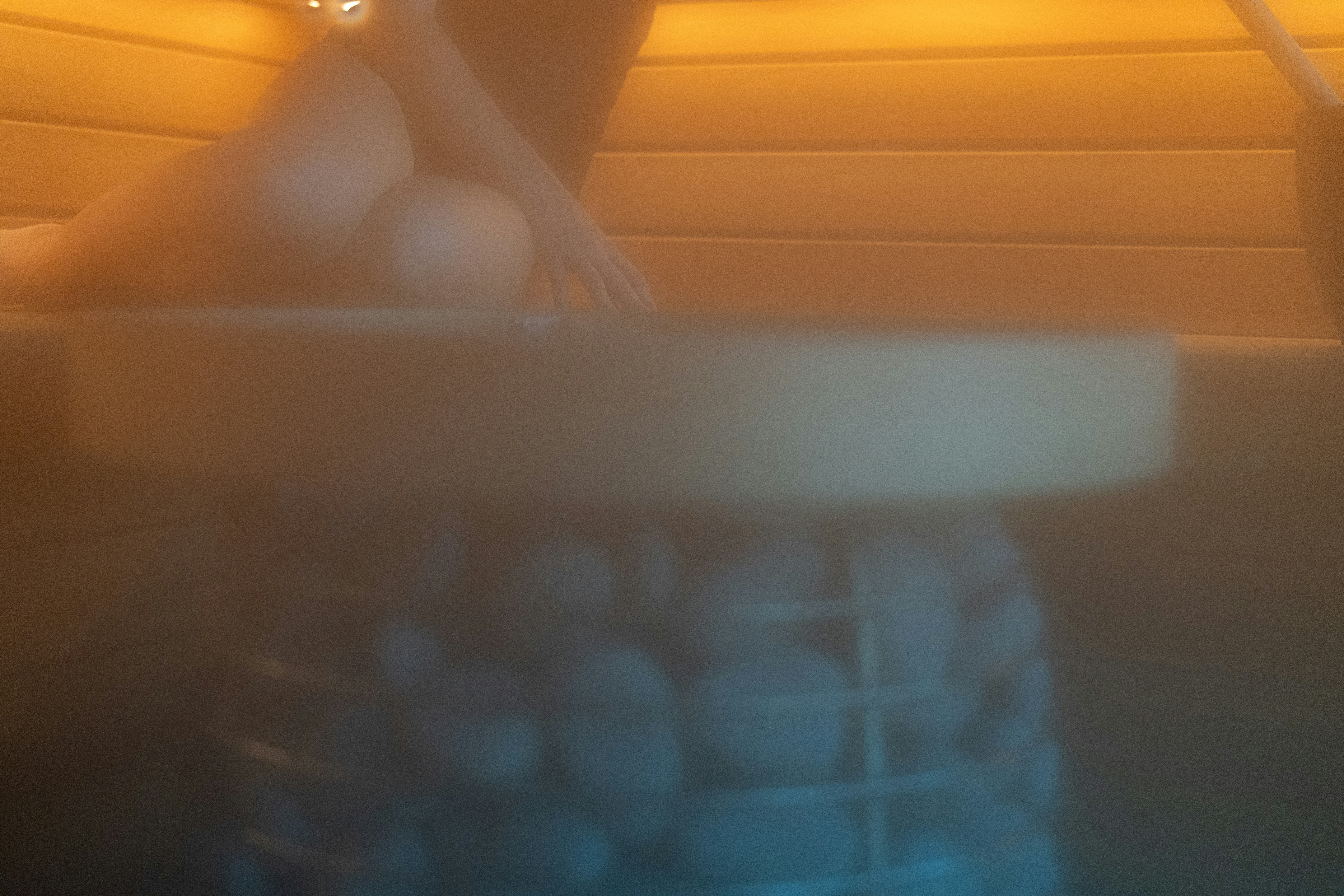 Steam rising from stones in a sauna