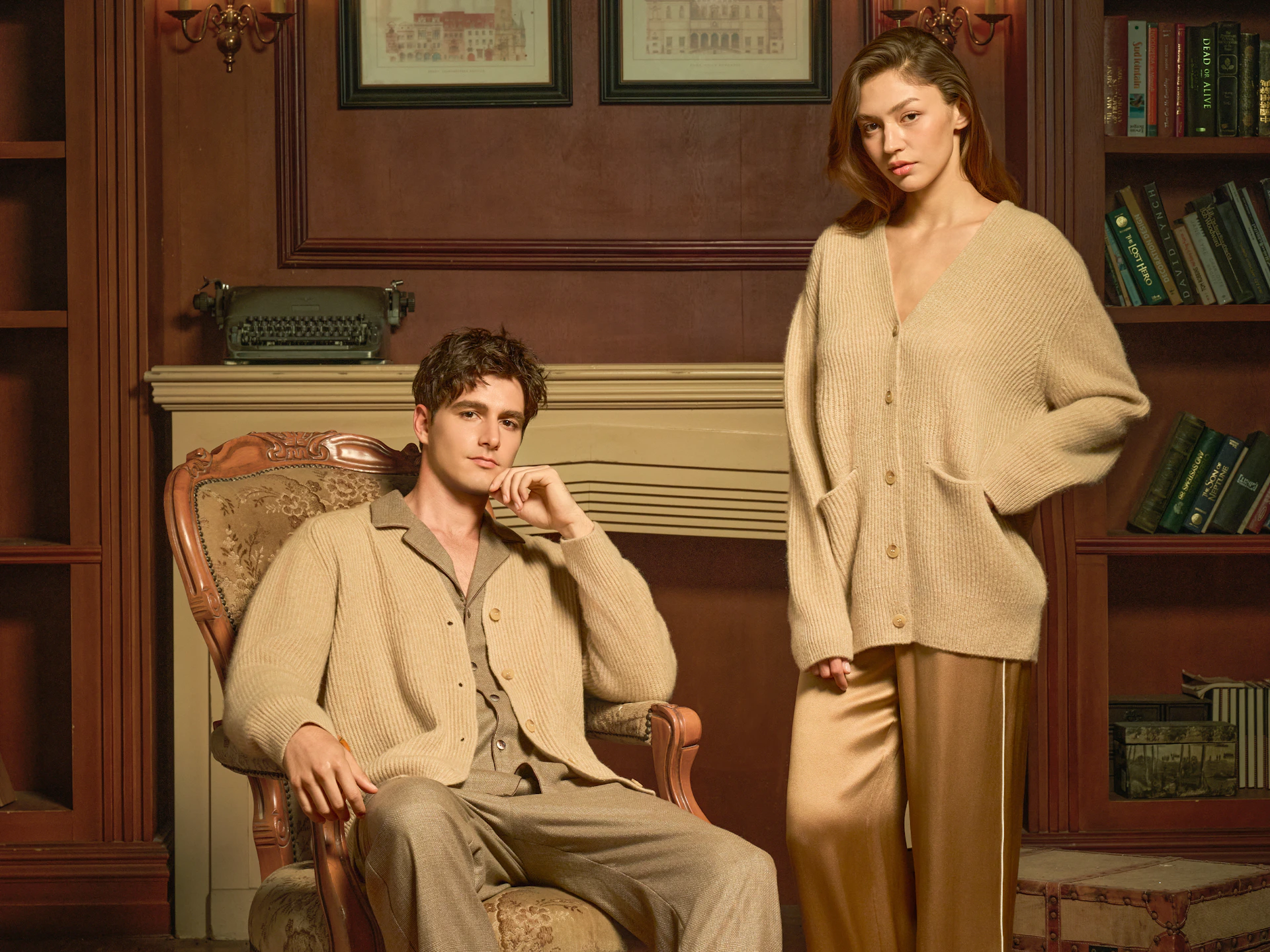 Couple in matching beige loungewear in a library.