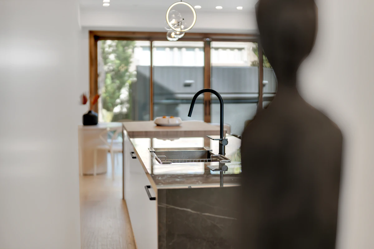 Kitchen island with sink and pendant lighting