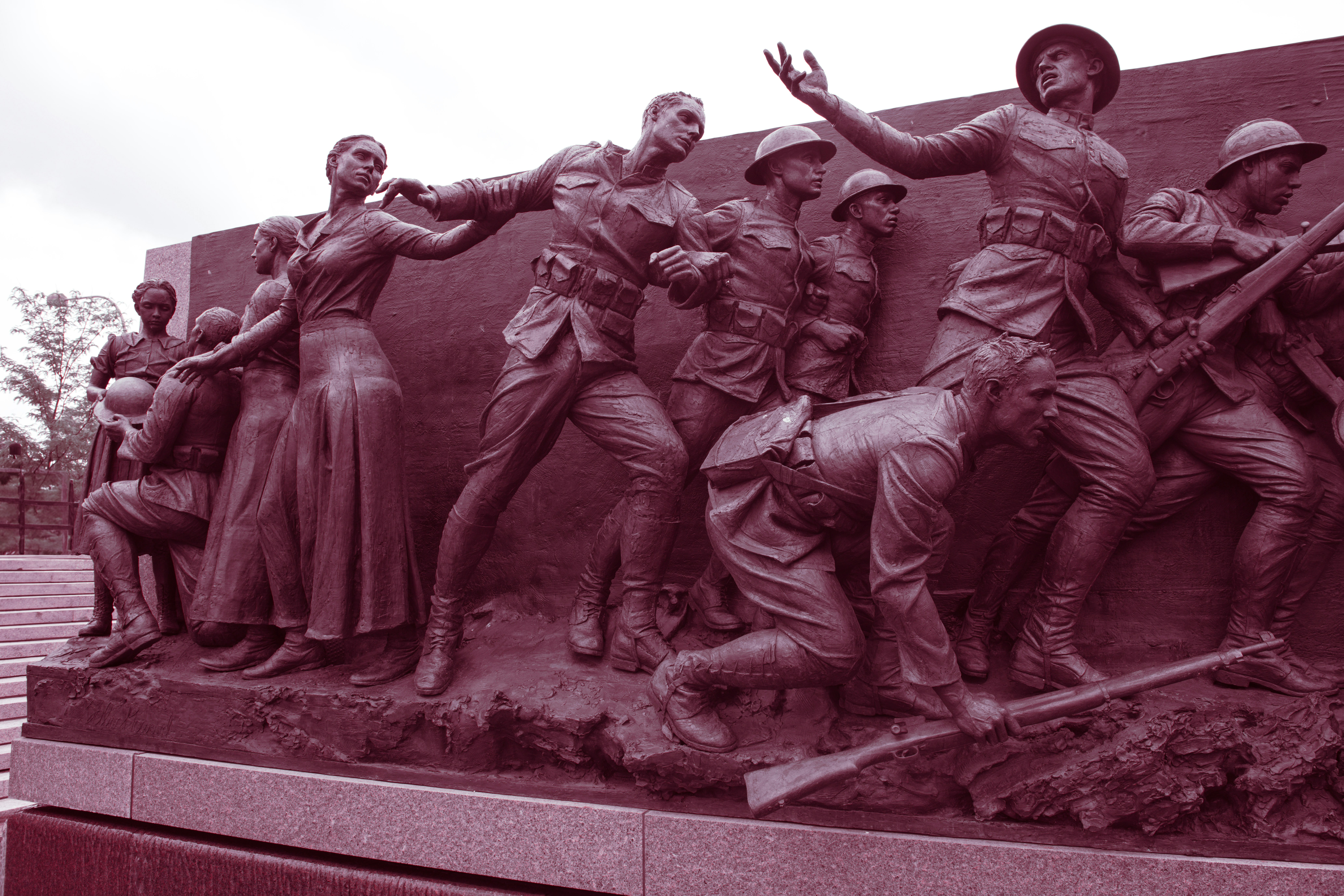 Bronze sculpture of soldiers and civilians in battle