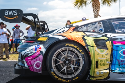 Race car with cartoon graphics and aws logo