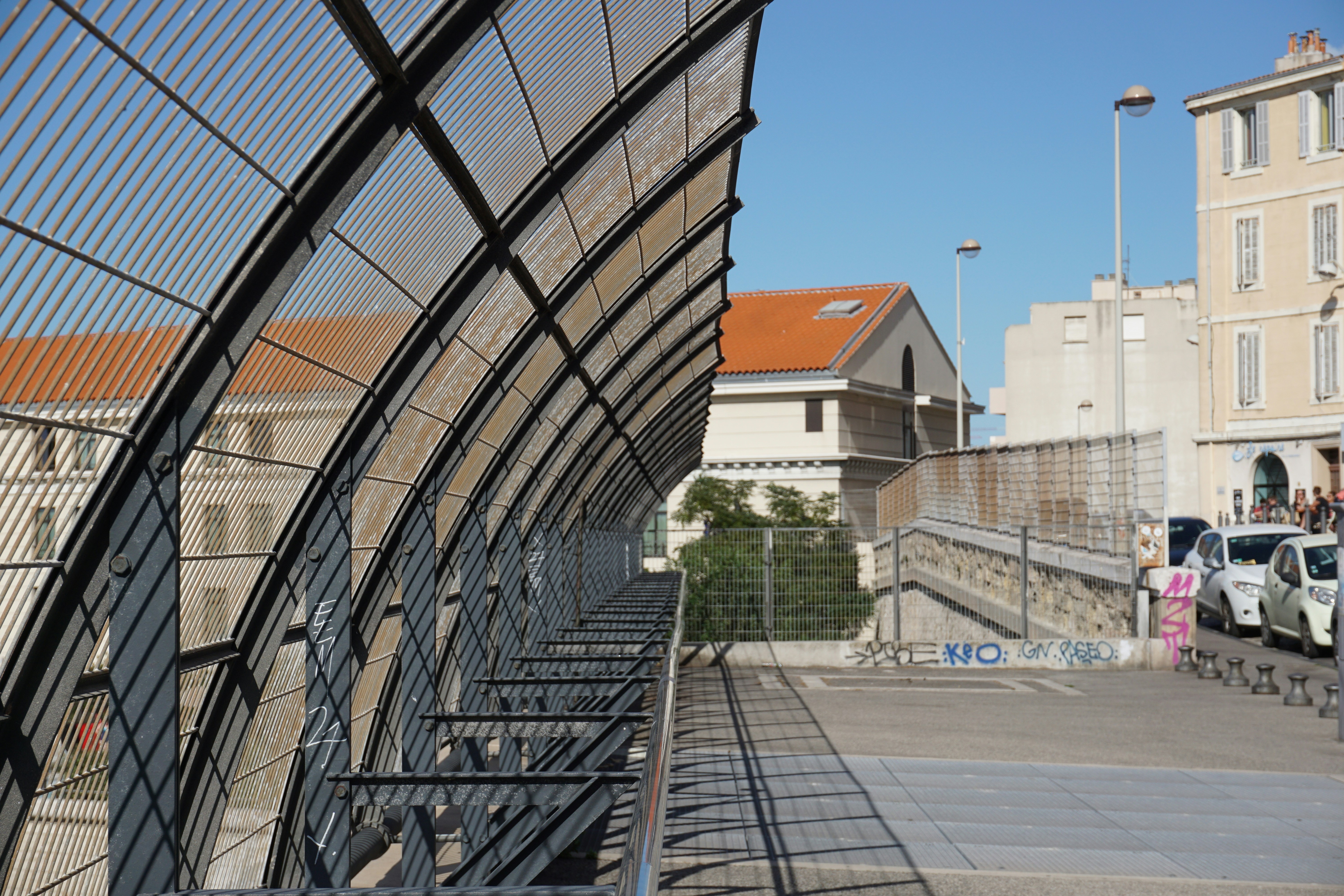 modern metal fence along a city street