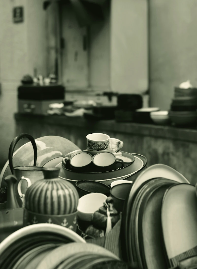 A stack of cups and dishes gathered together