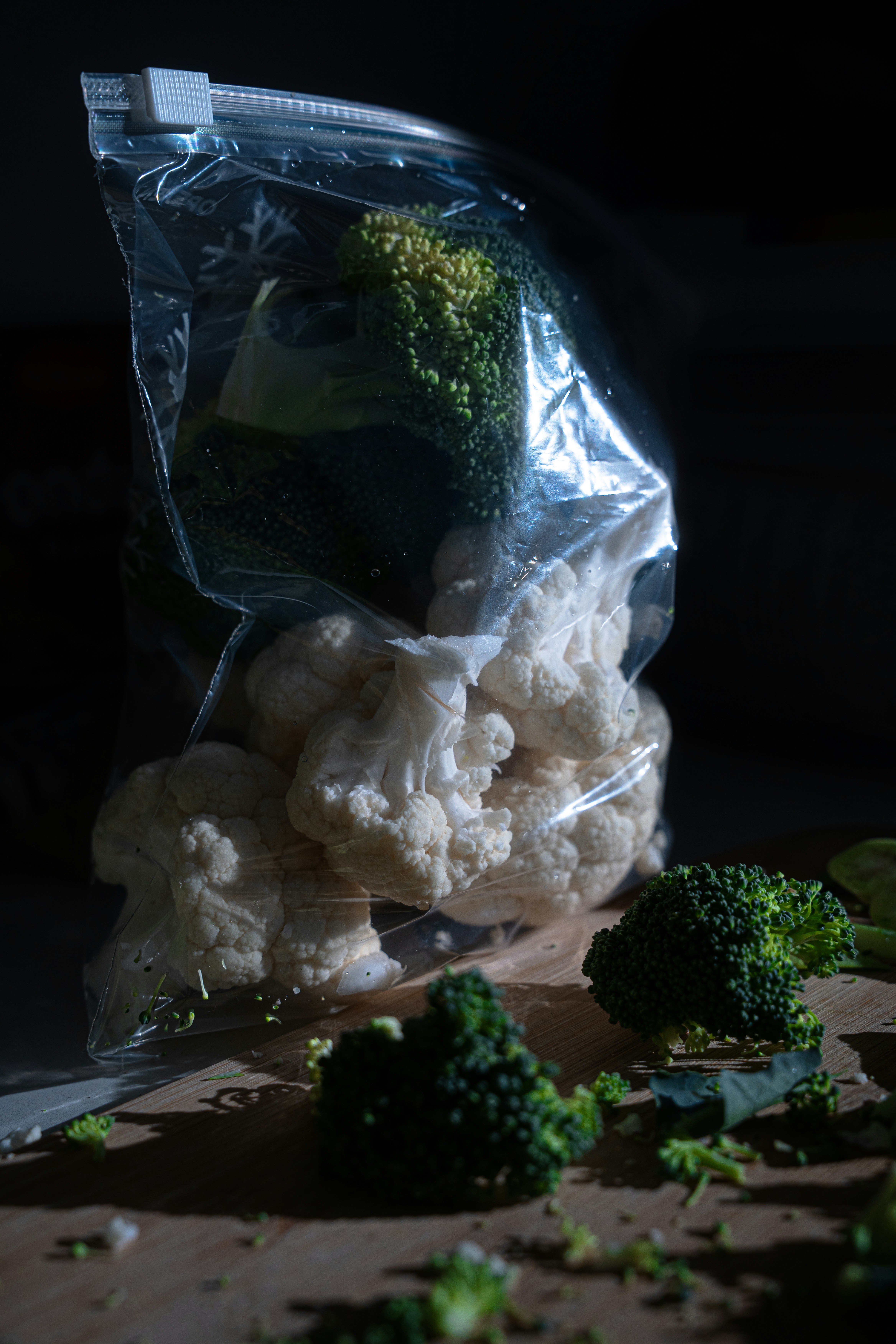 Broccoli and cauliflower florets in a plastic bag.