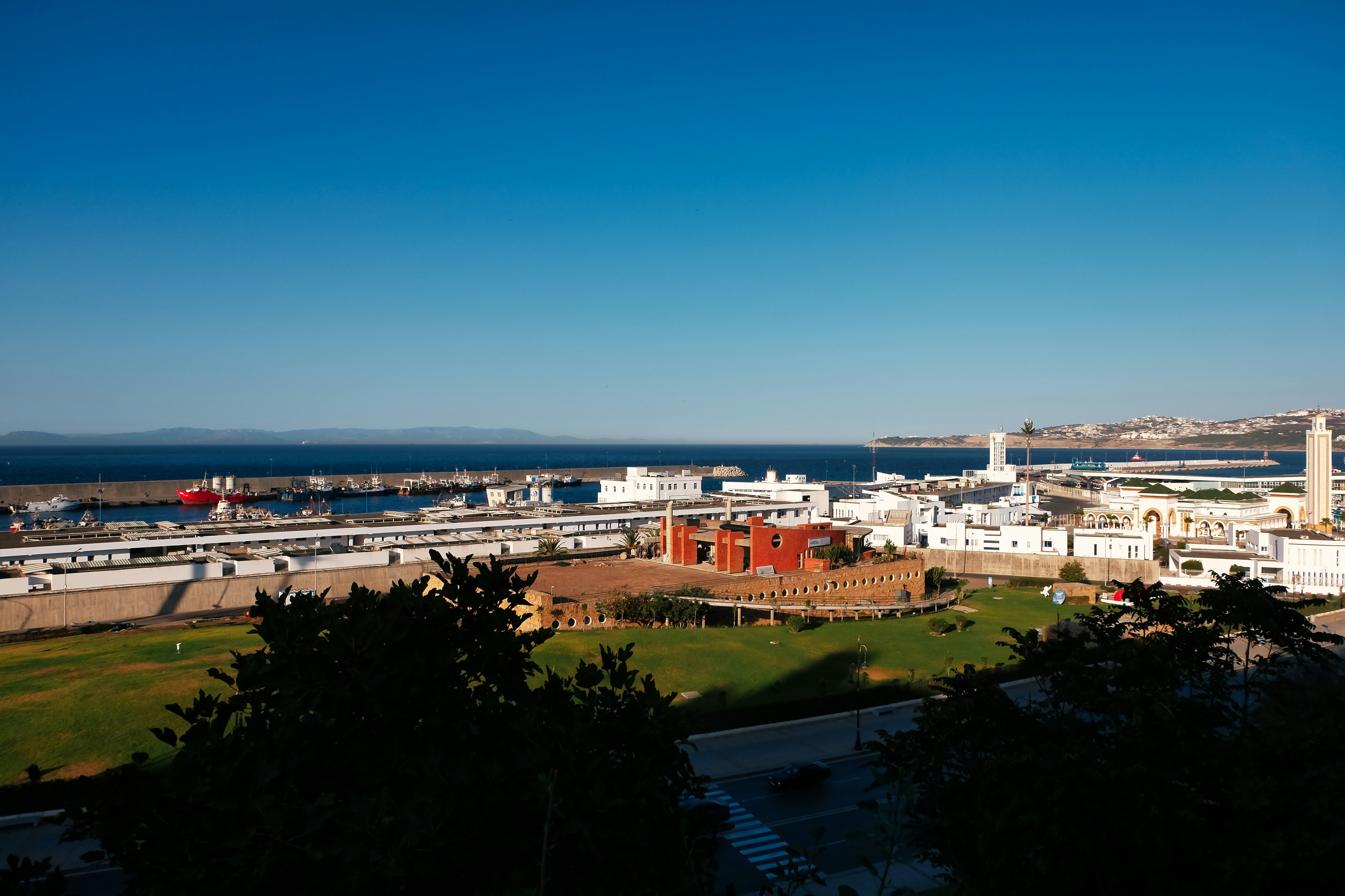Coastal city with harbor and clear blue sky