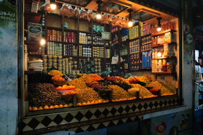 A colorful market stall overflowing with dried fruits and nuts.