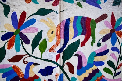 Colorful folk art with animals and flowers on white background.