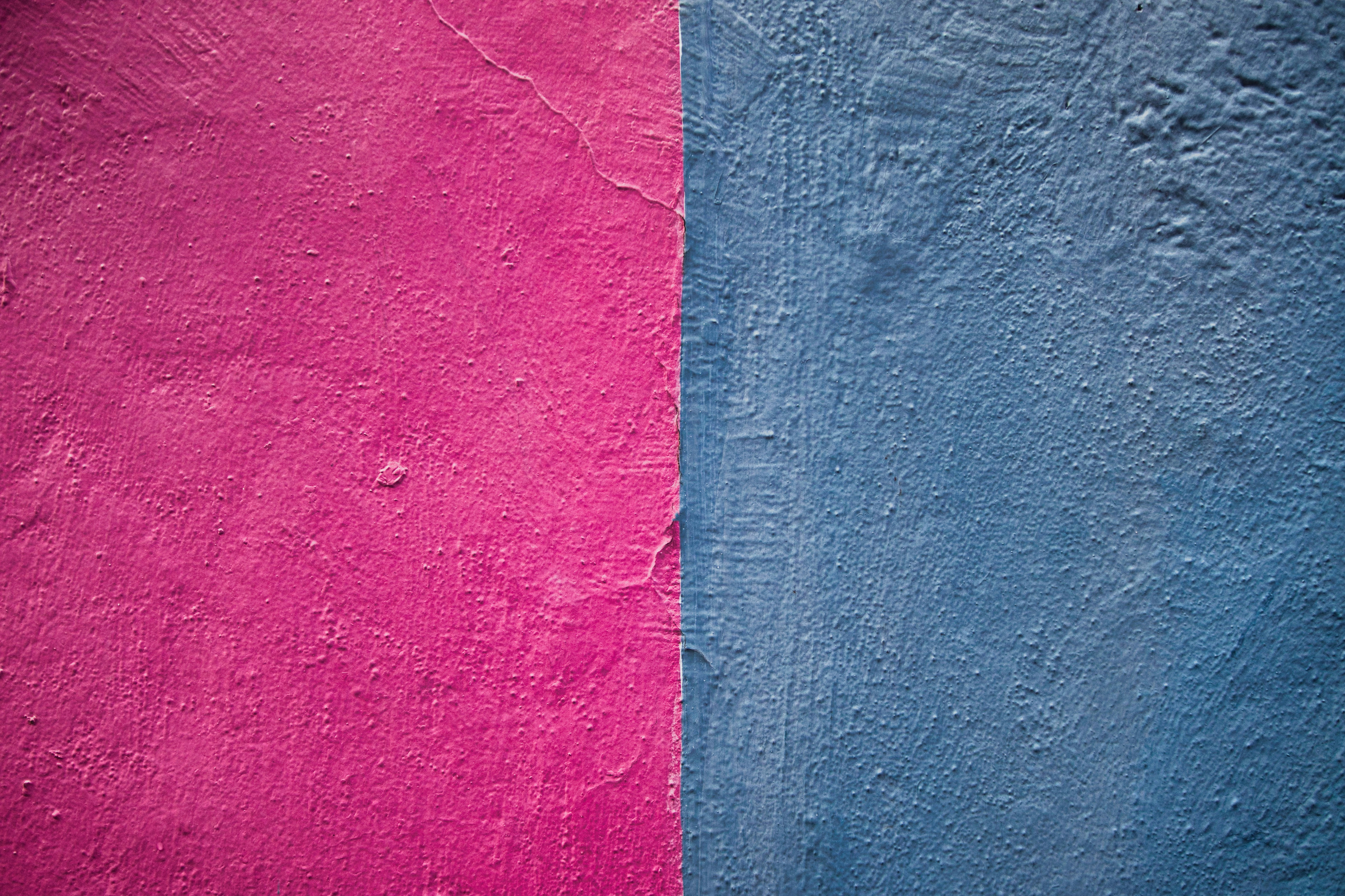 Pink and blue textured wall divided vertically