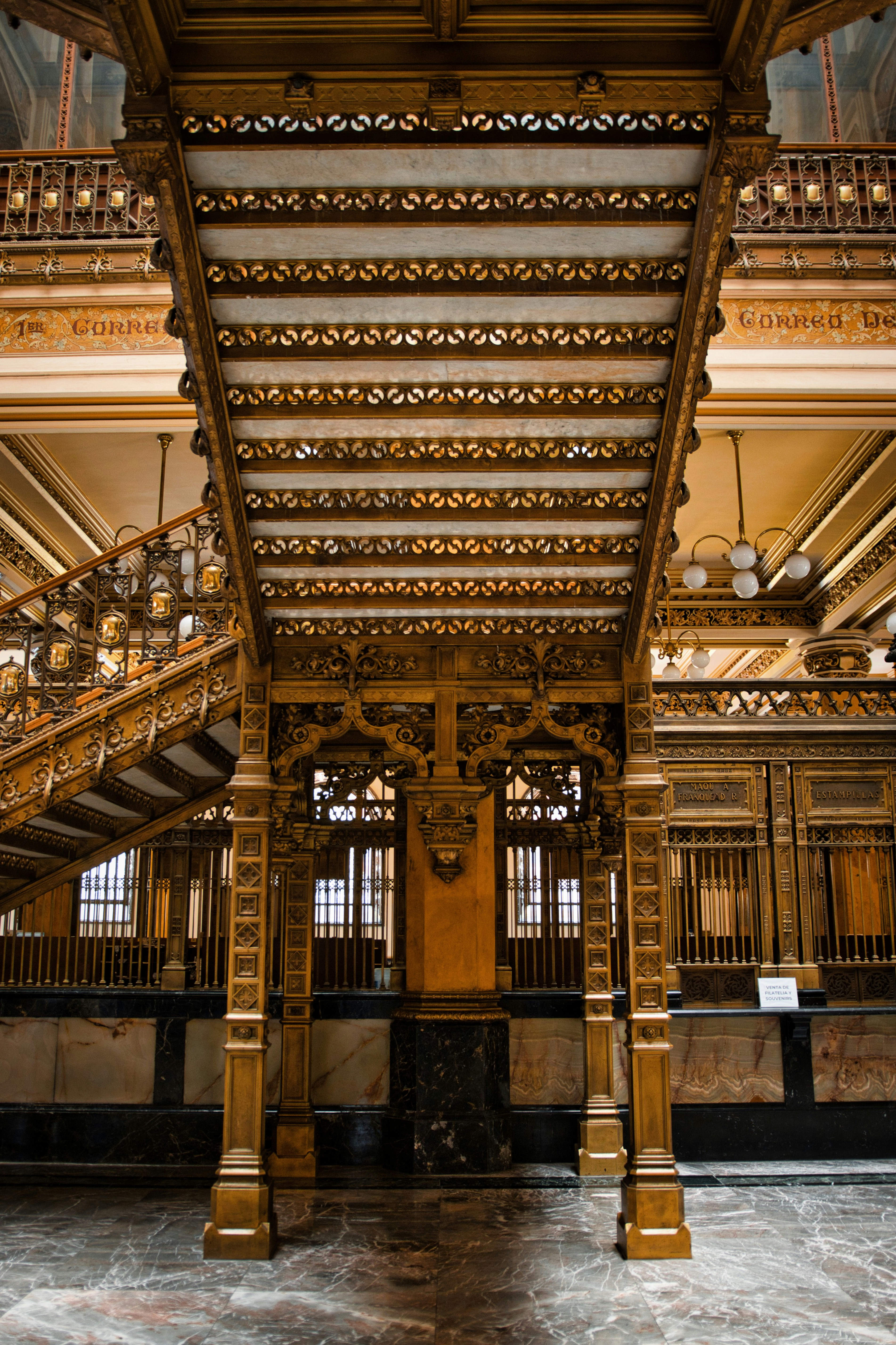 Ornate wooden staircase inside a grand building