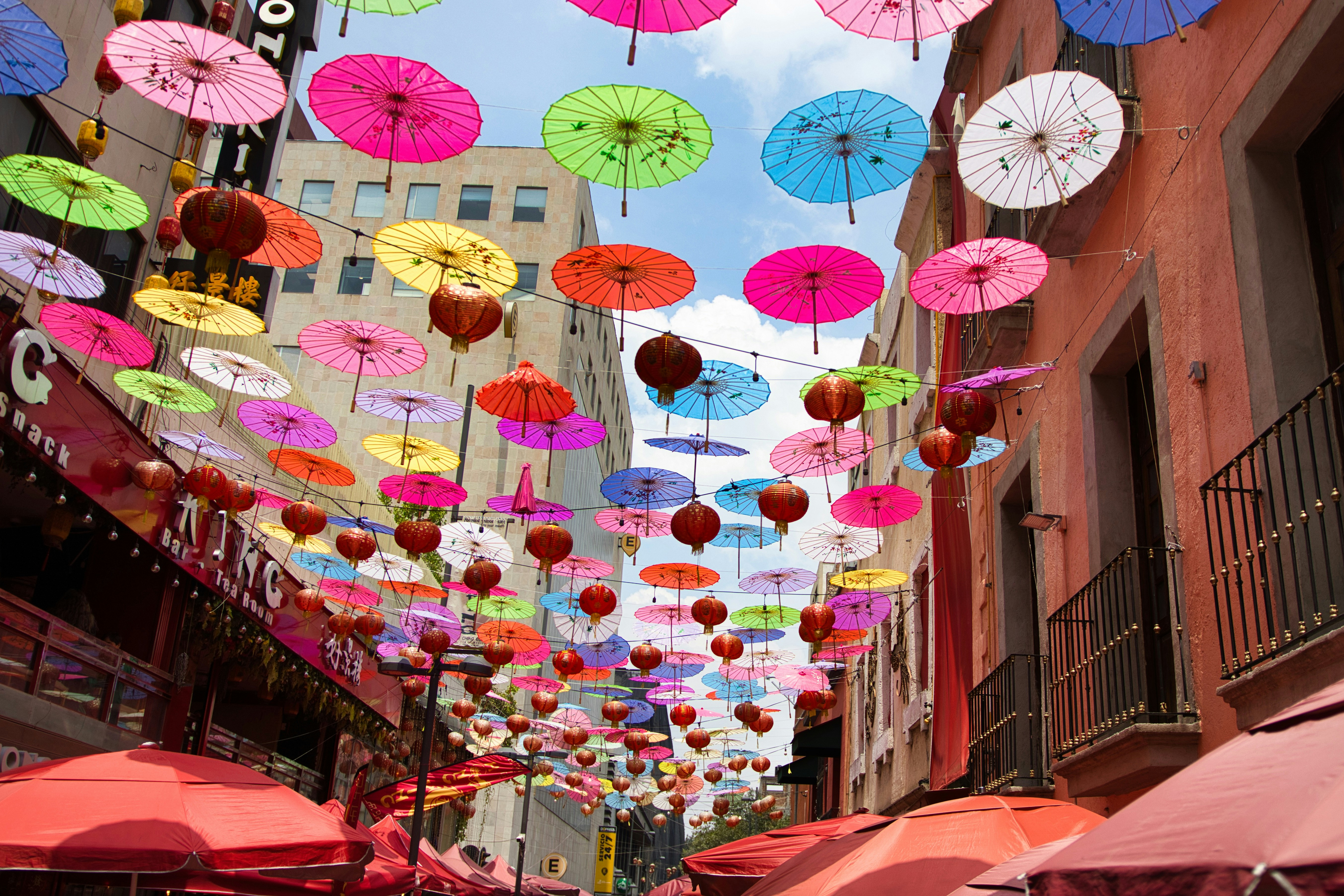 Colorful umbrellas and lanterns decorating a Mexican street