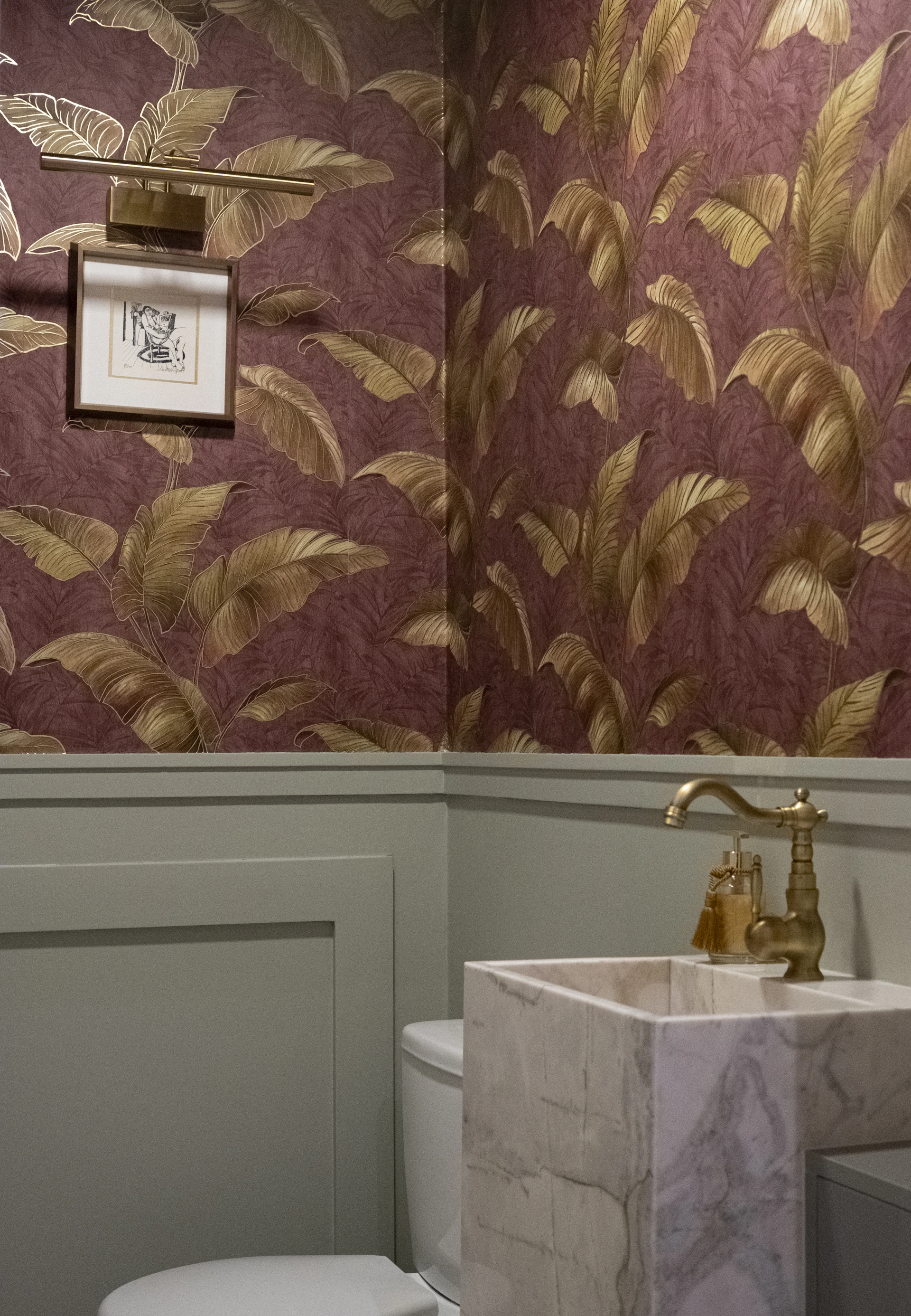 Powder room with floral wallpaper and marble sink