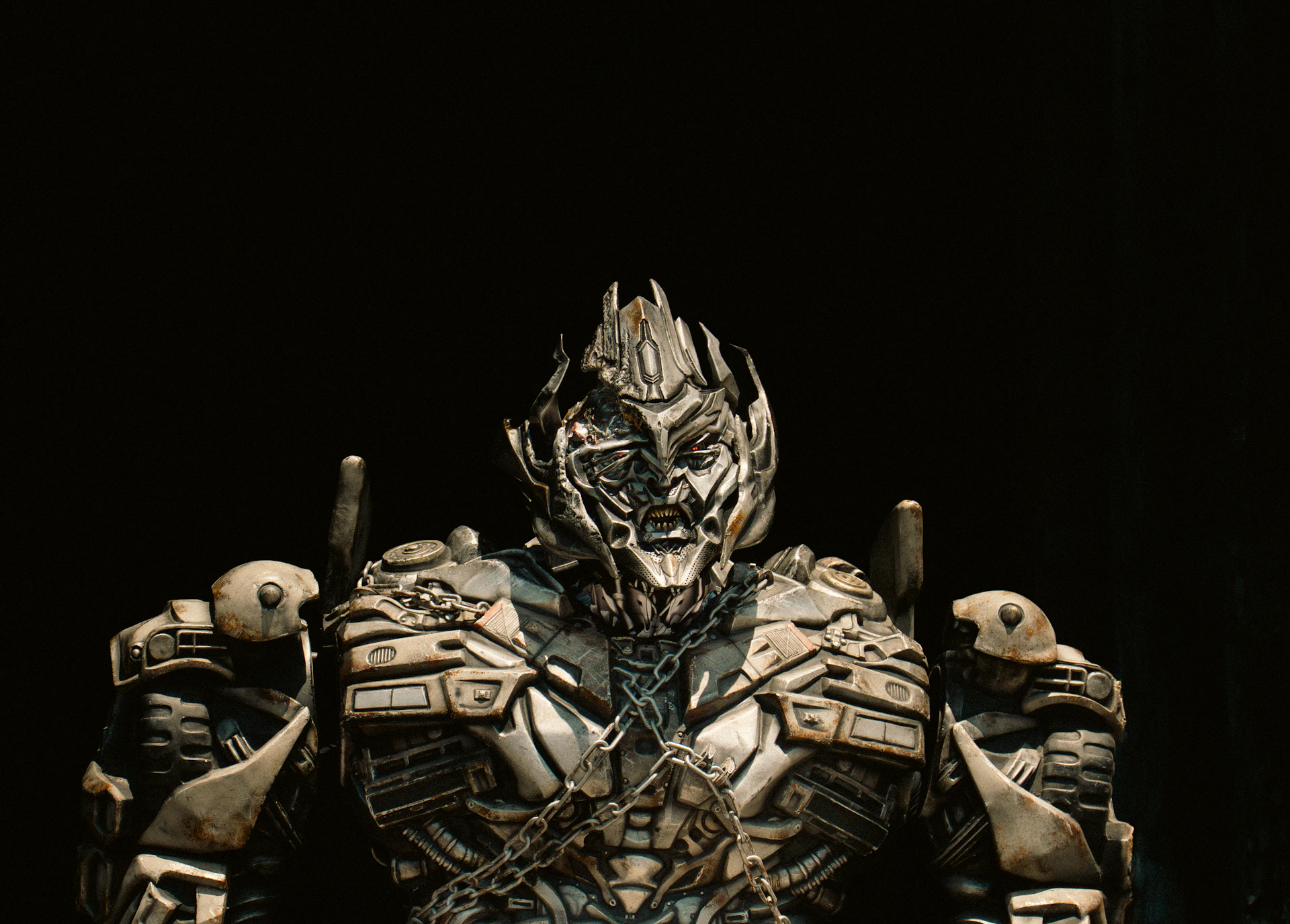 A menacing robot with a detailed metallic face