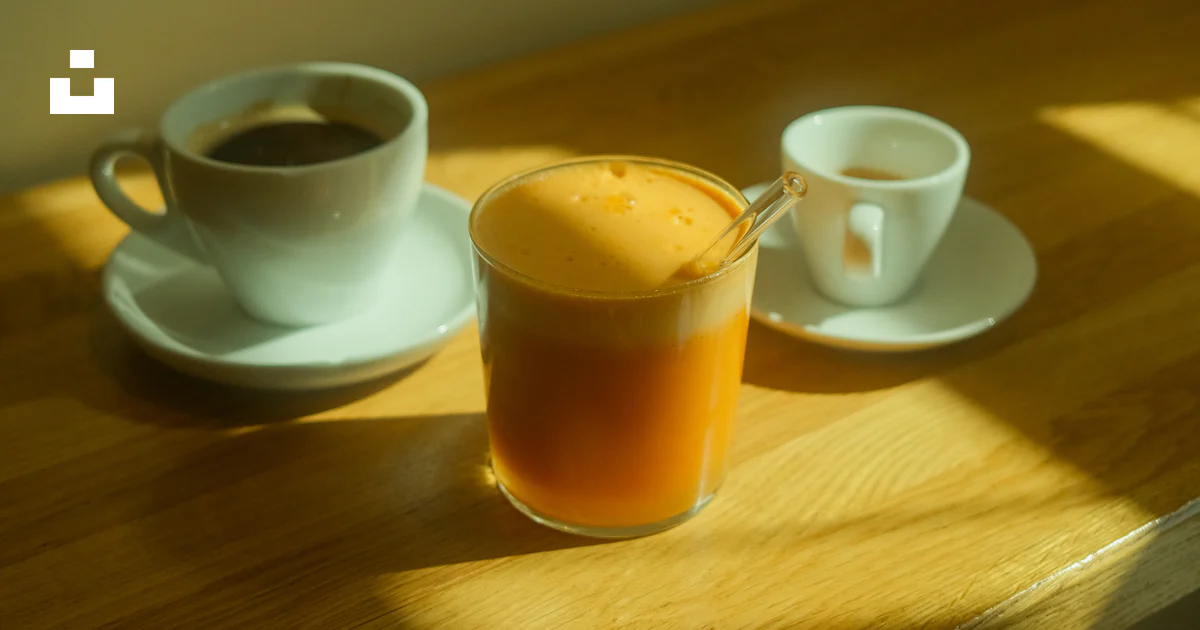 Three cups of coffee and juice on wooden table. photo – Free Coffee ...