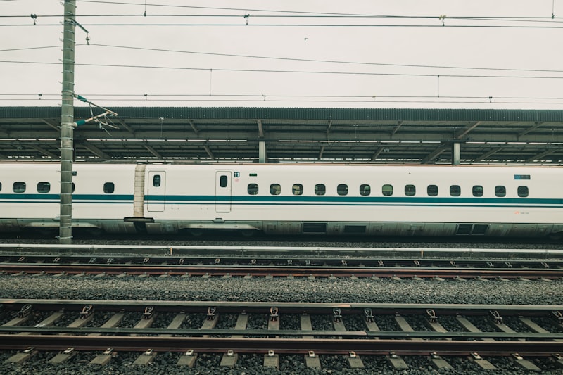 Sanyo Shinkansen train, railway infrastructure, high-speed rail tracks, power line, train station platform