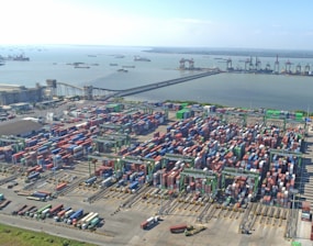 Aerial view of a busy shipping port with many containers.