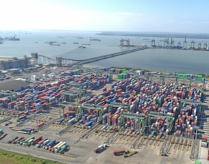 Aerial view of a busy shipping port with many containers.