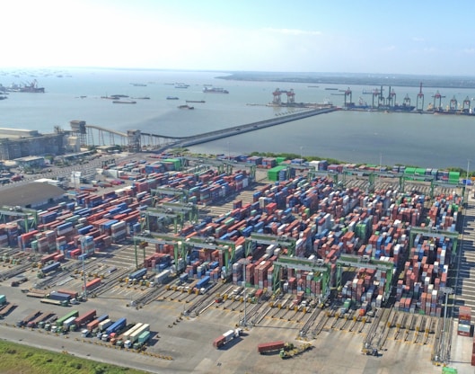 Aerial view of a busy shipping port with many containers.