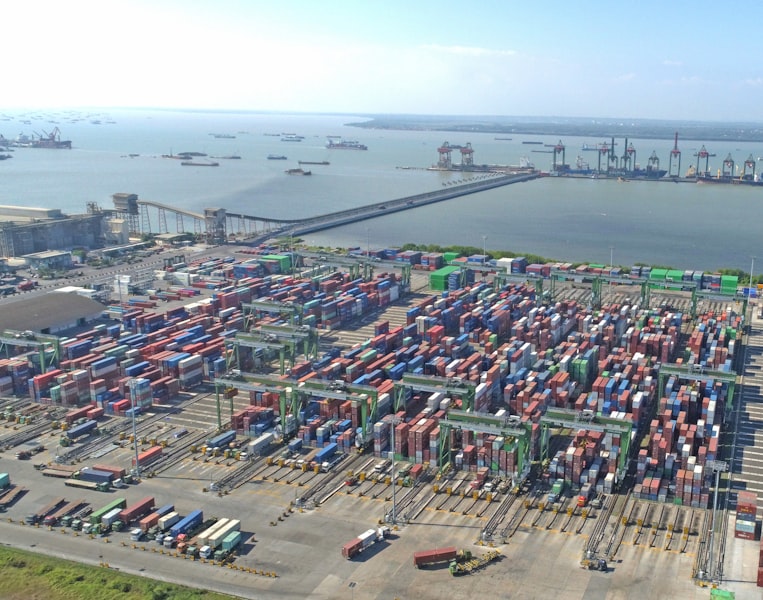 Aerial view of busy shipping port with cargo containers