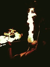 Performer breathes a large plume of fire