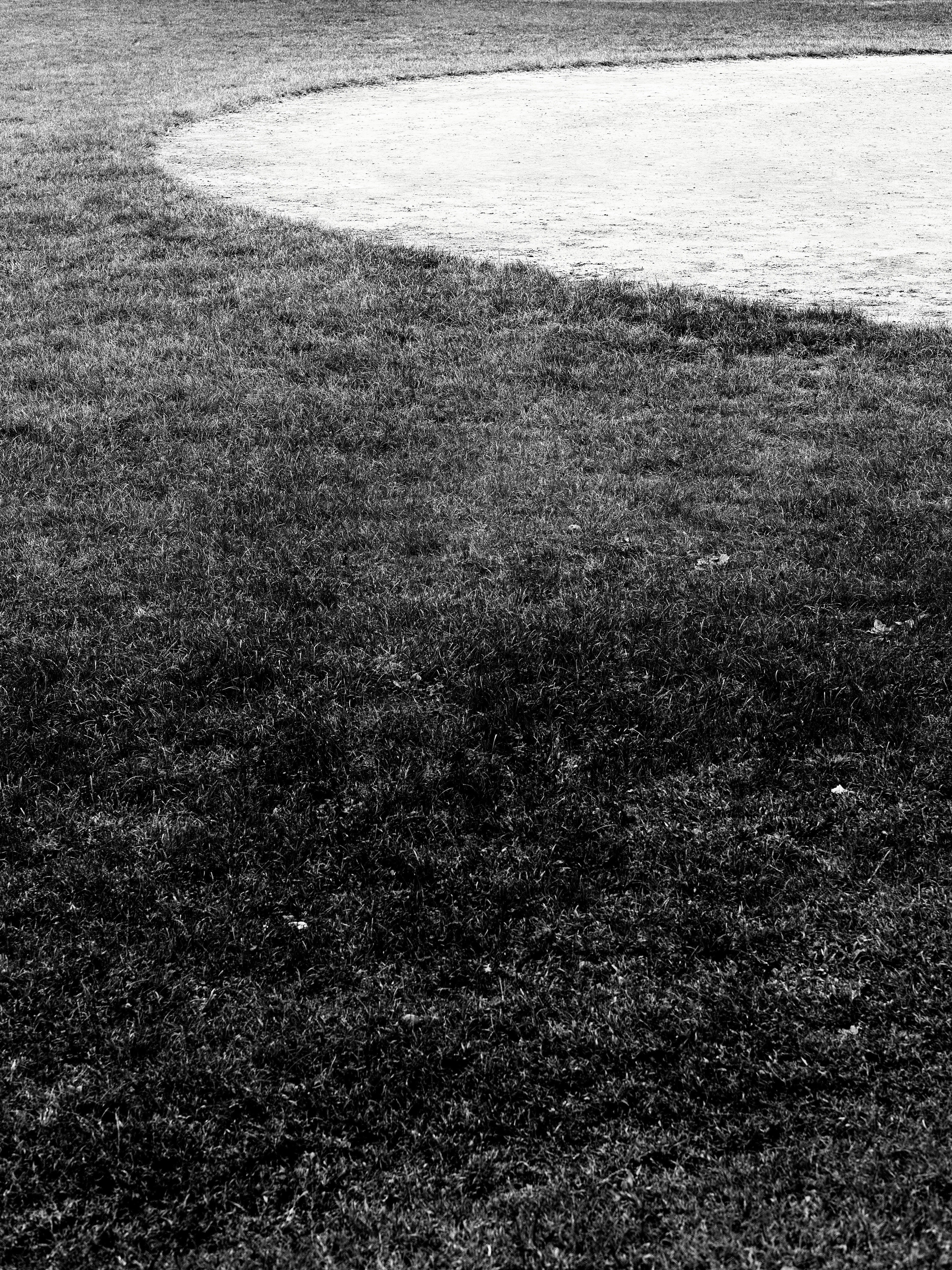 Grassy area next to a sand trap