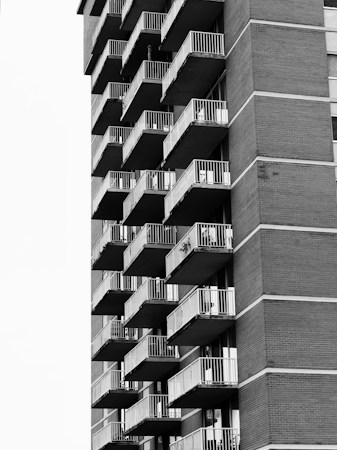 Rows of balconies on a modern apartment building, the kind of rental housing where Las Vegas rents have fallen 3.6 percent in a year