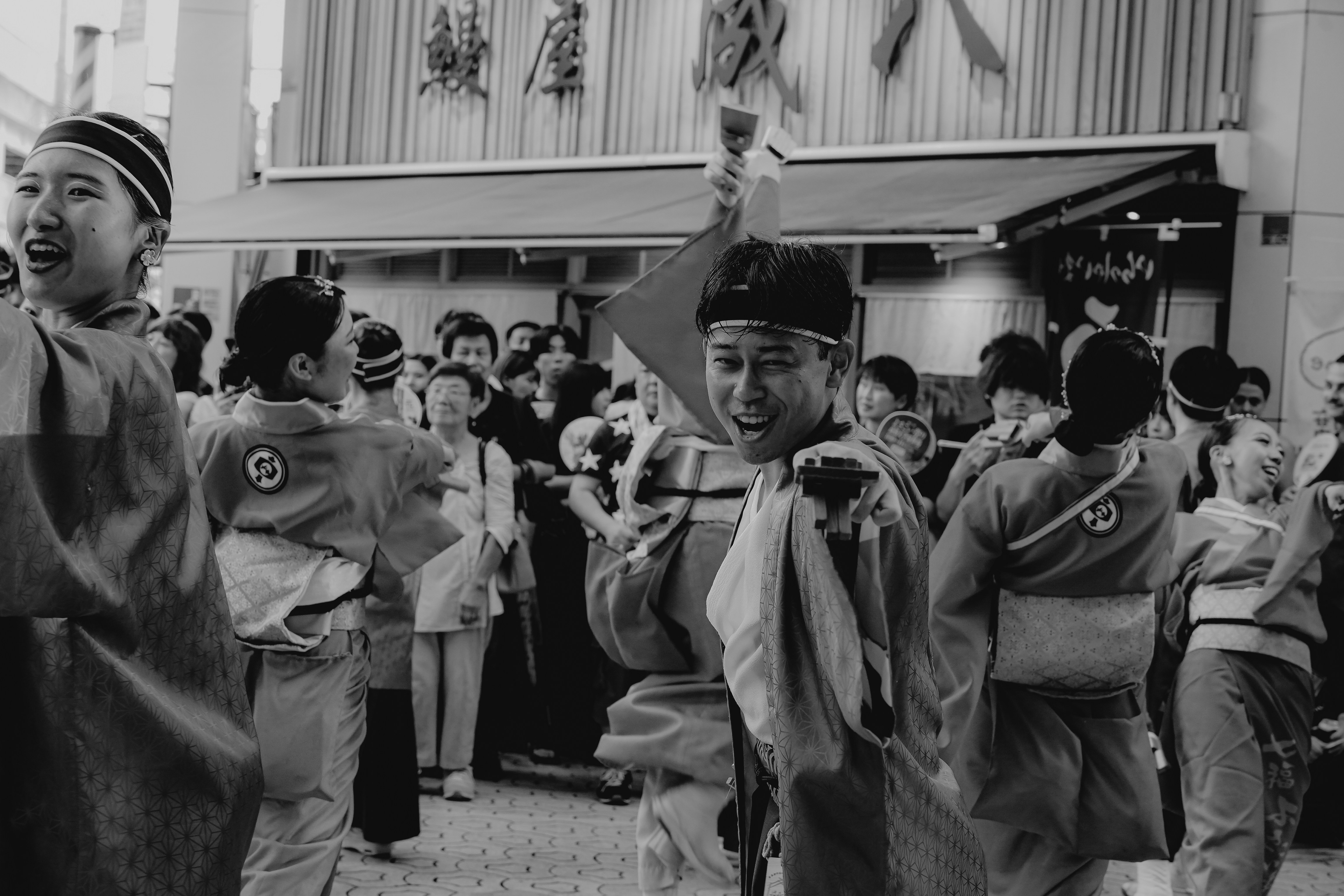 People in traditional Japanese clothing celebrating outdoors
