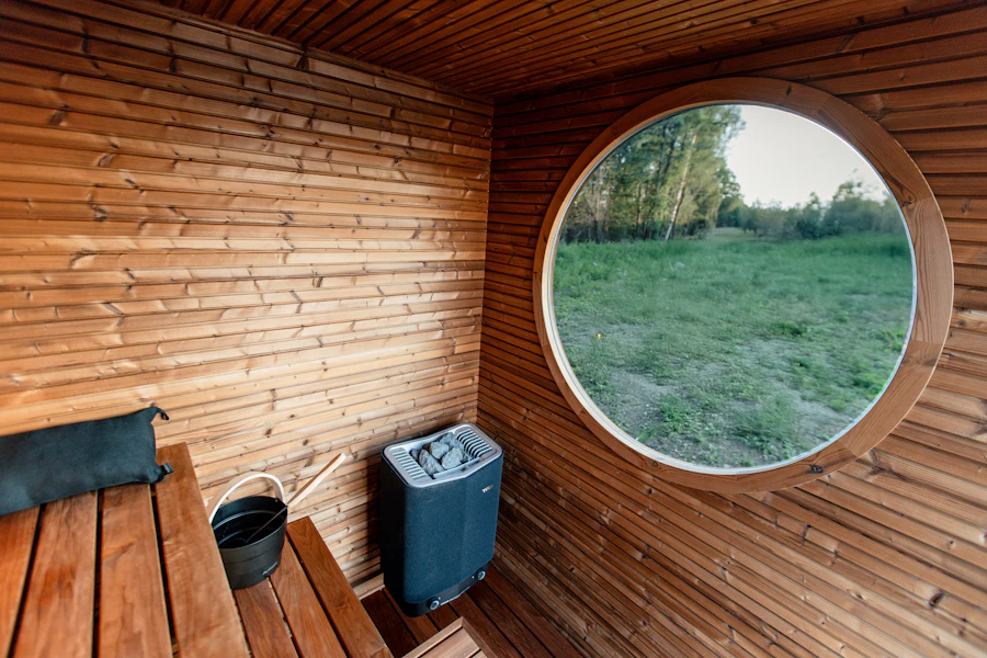 A barrel sauna with a round window