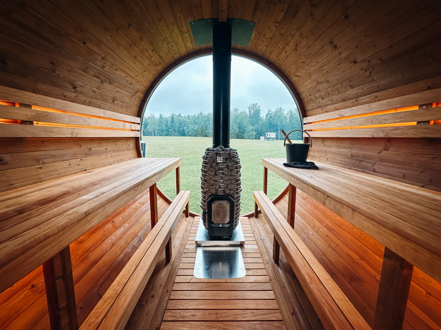 Inside a barrel sauna with its stove